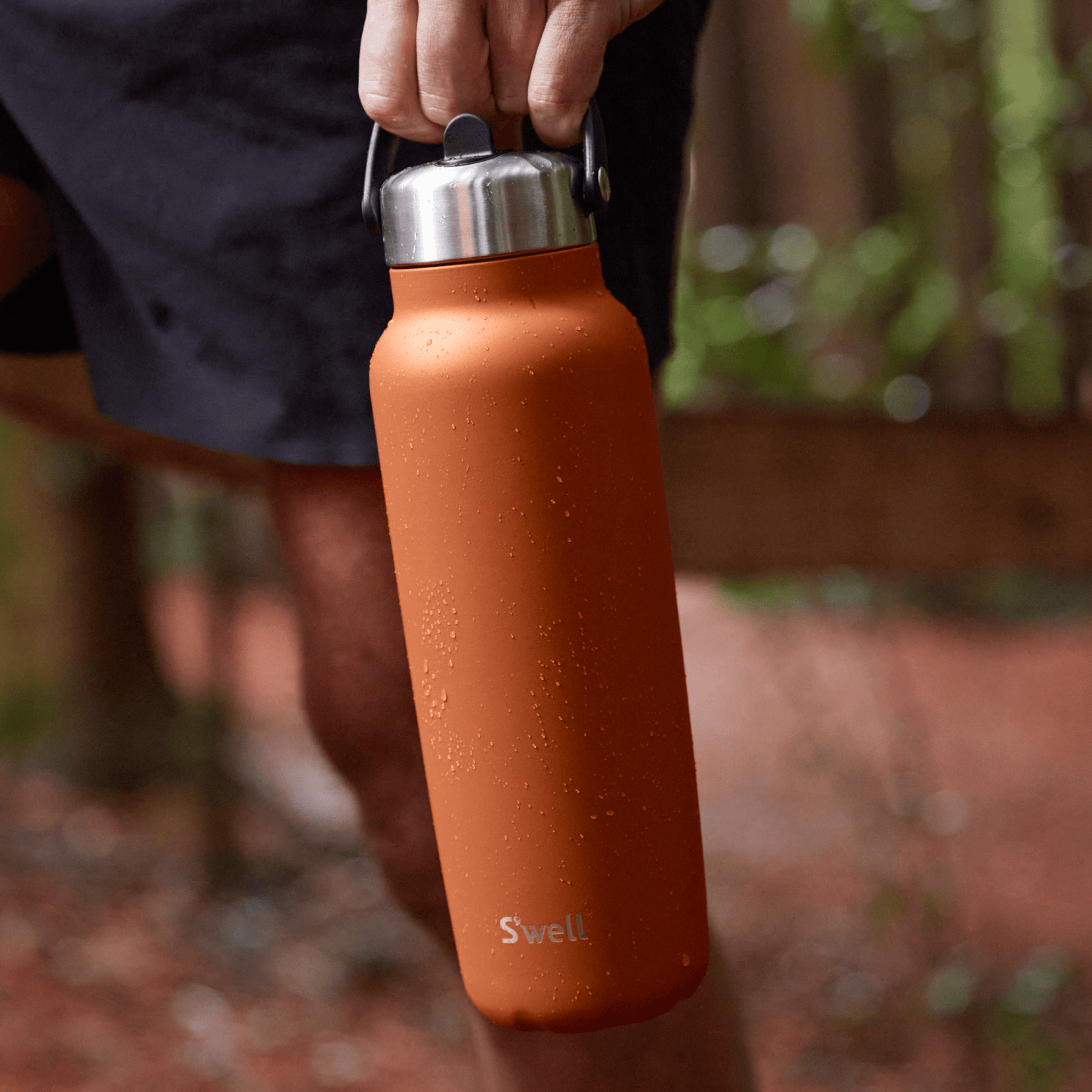 explorer-with-flip-straw-lid-40oz-x4 Swell-Explorer-Water-Bottle-40oz-Orange-Carnelian-LifeStyle.png