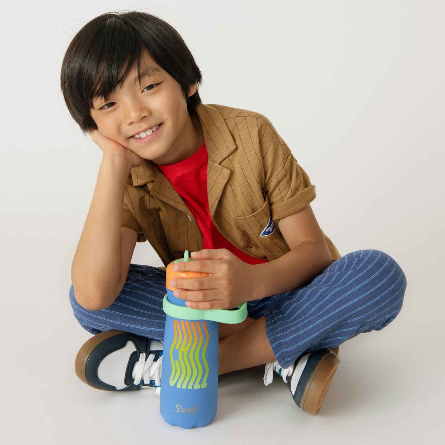 traveler-with-flip-straw-lid-16oz-l3 Swell-Kids-Water-Bottle-Traveler-16oz-Blue-Chill-Lifestyle.jpg